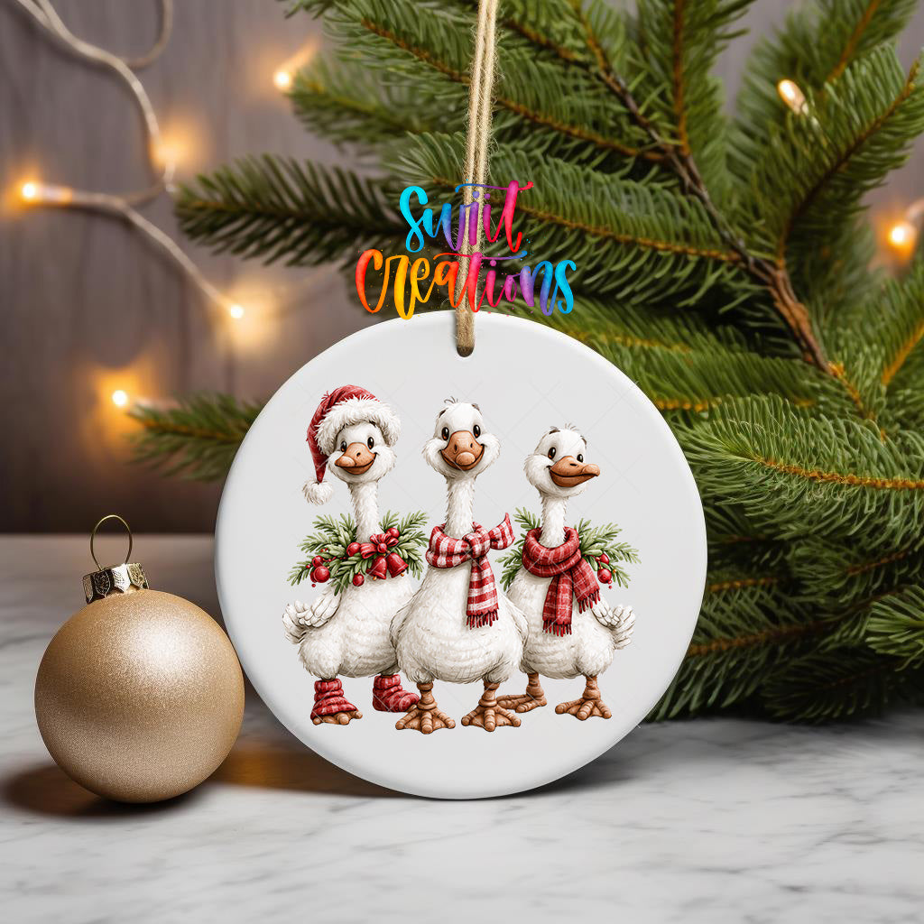 Three Christmas geese ornament UV DTF transfer with red plaid scarves, greenery, and berries, mockup view 3