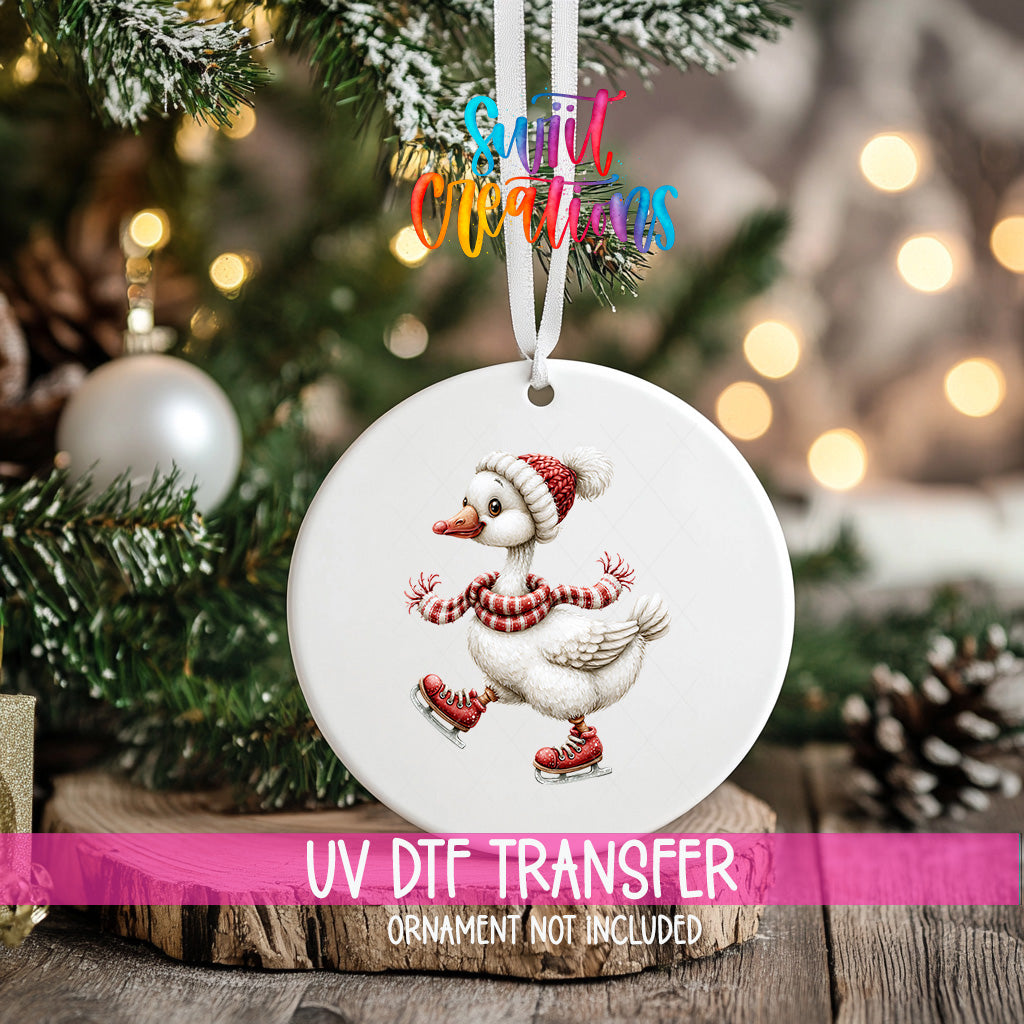 Christmas goose ornament UV DTF transfer ice skating in red skates, scarf, and knit hat, mockup view 2