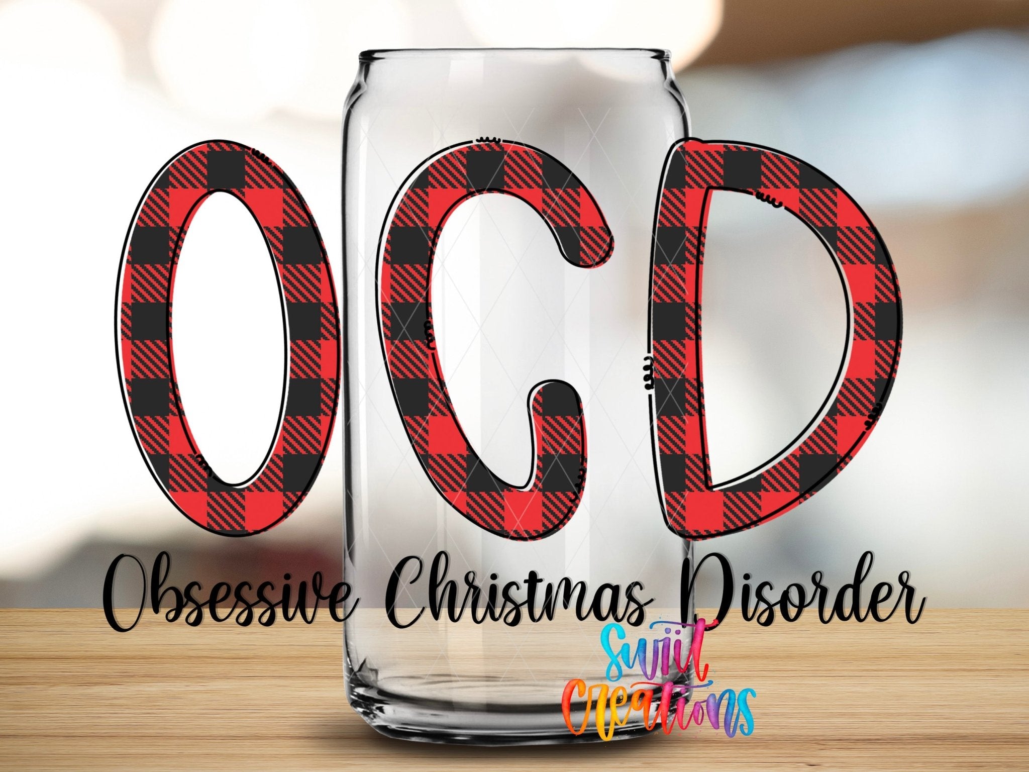 OCD Obsessive Christmas Disorder UV DTF transfer applied to a clear glass can from Swiit Creations