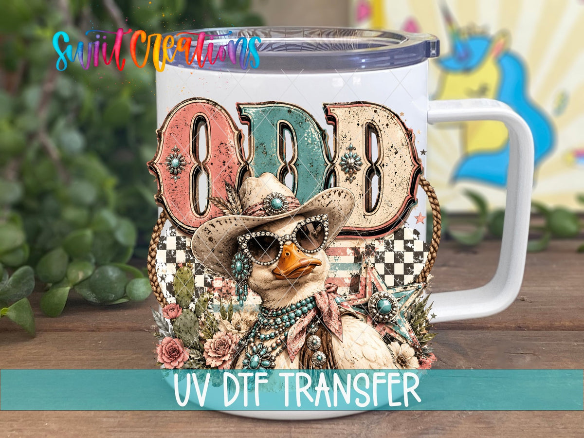 Odd Duck Western Glam UV DTF transfer displayed on a white coffee mug from Swiit Creations