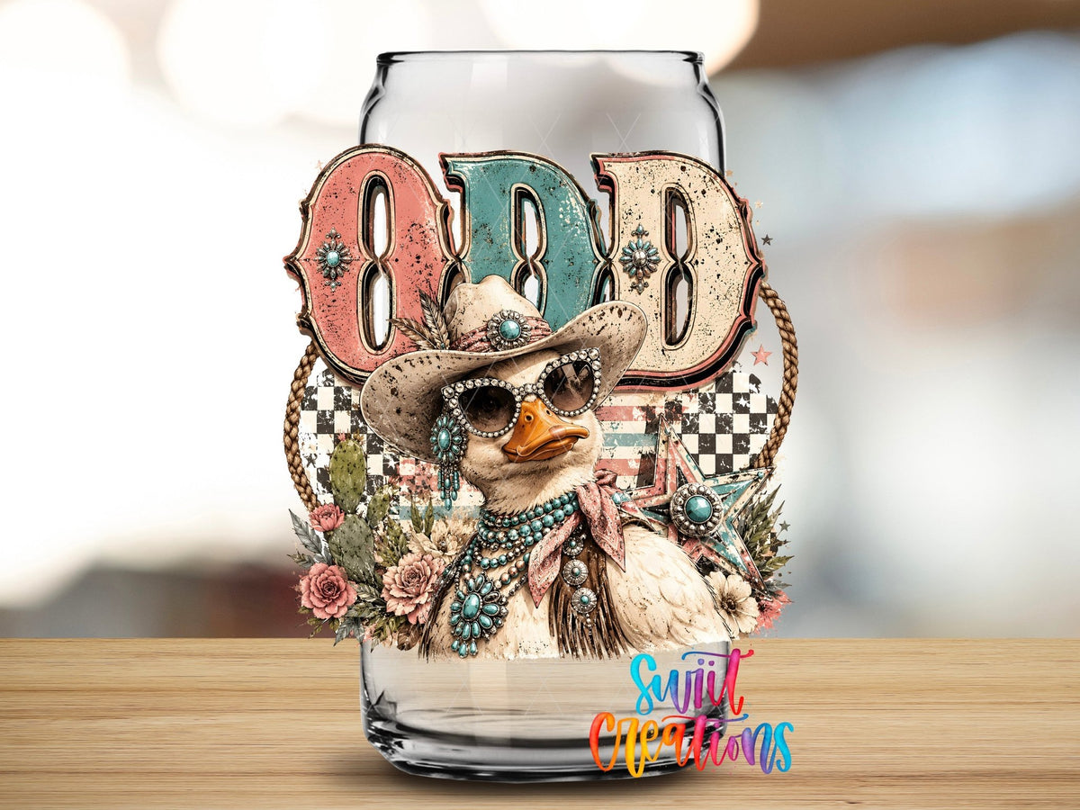 Odd Duck Western Glam UV DTF transfer applied to a clear glass can from Swiit Creations