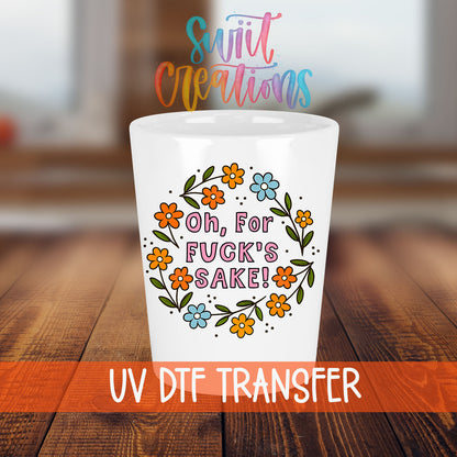 Oh For Fuck's Sake Floral shot glass transfer on a white shot glass on a wooden table