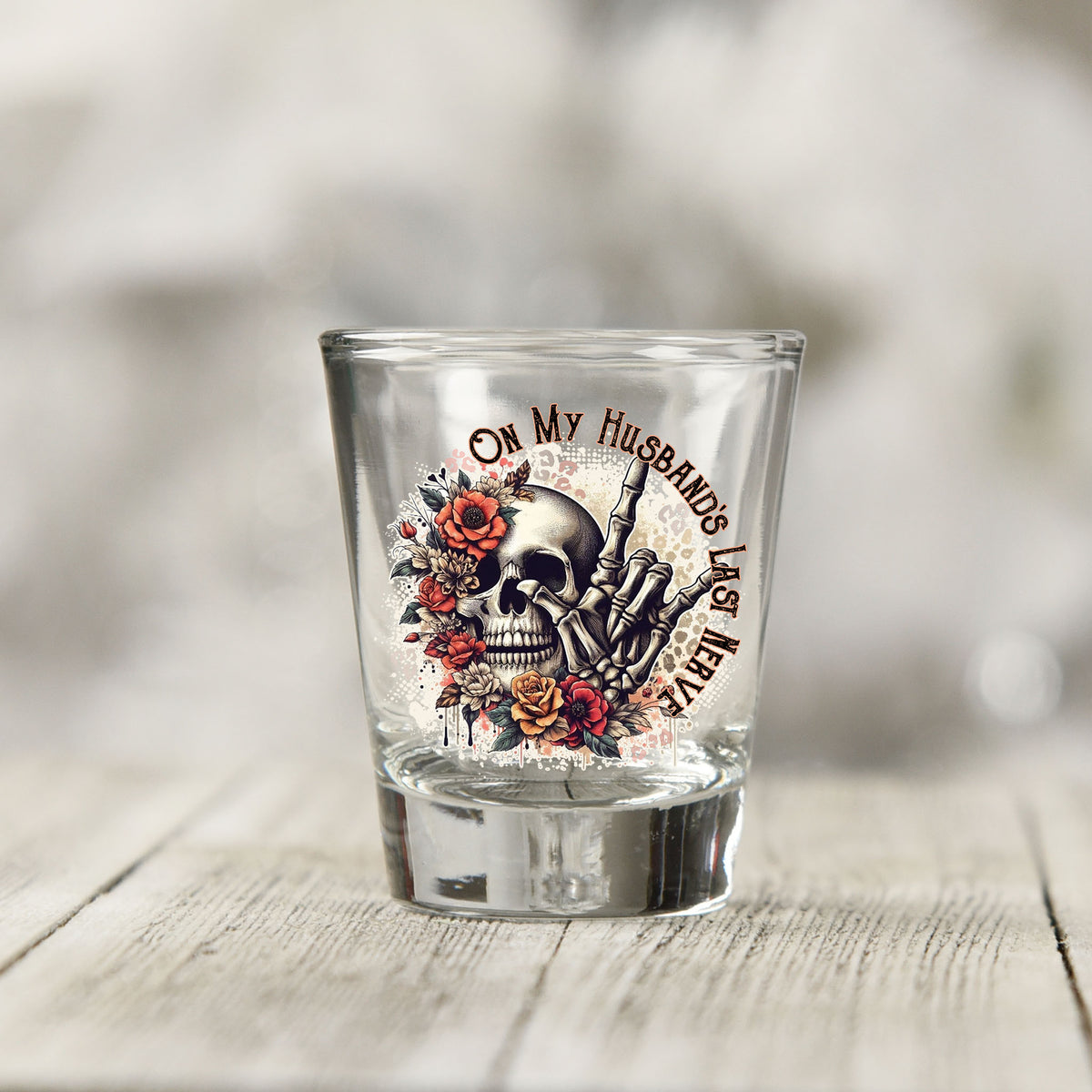 Close-up of the On My Husband's Last Nerve UV DTF transfer on a clear shot glass