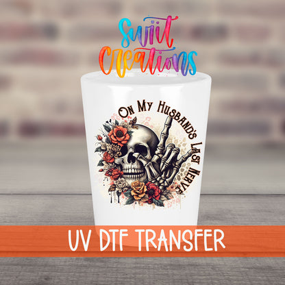 On My Husband's Last Nerve UV DTF transfer on a white shot glass in front of a brick wall