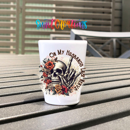 On My Husband's Last Nerve UV DTF transfer on a white shot glass on an outdoor patio table