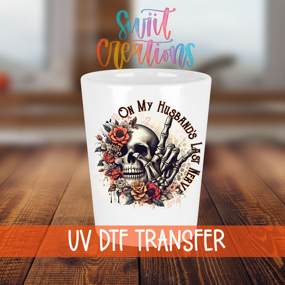 On My Husband's Last Nerve shot glass transfer on a white shot glass on a wooden table