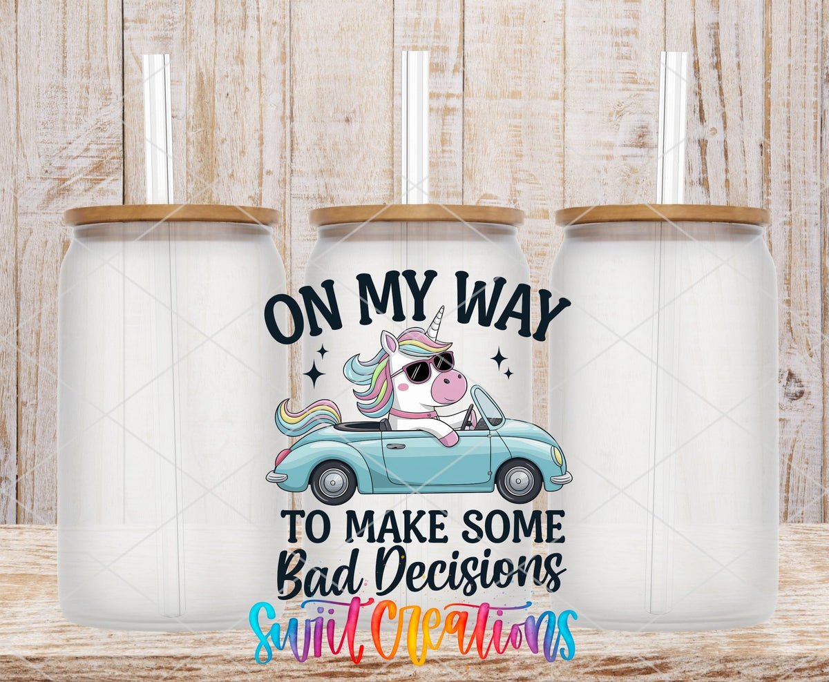 On My Way to Make Some Bad Decisions unicorn driving UV DTF transfer on frosted glass cans with bamboo lids
