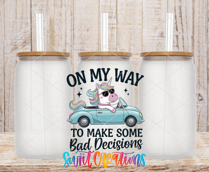 On My Way to Make Some Bad Decisions unicorn driving UV DTF transfer on frosted glass cans with bamboo lids