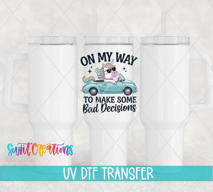 On My Way to Make Some Bad Decisions unicorn driving UV DTF transfer on white 40 oz tumblers