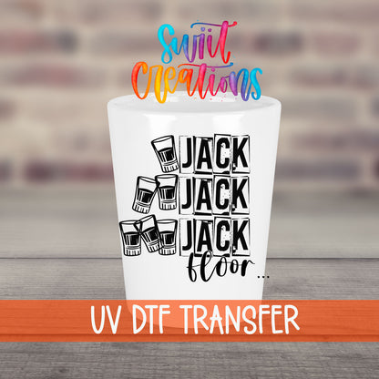 One Jack Two Jack Three Jack Floor UV DTF transfer on a white shot glass in front of a brick wall