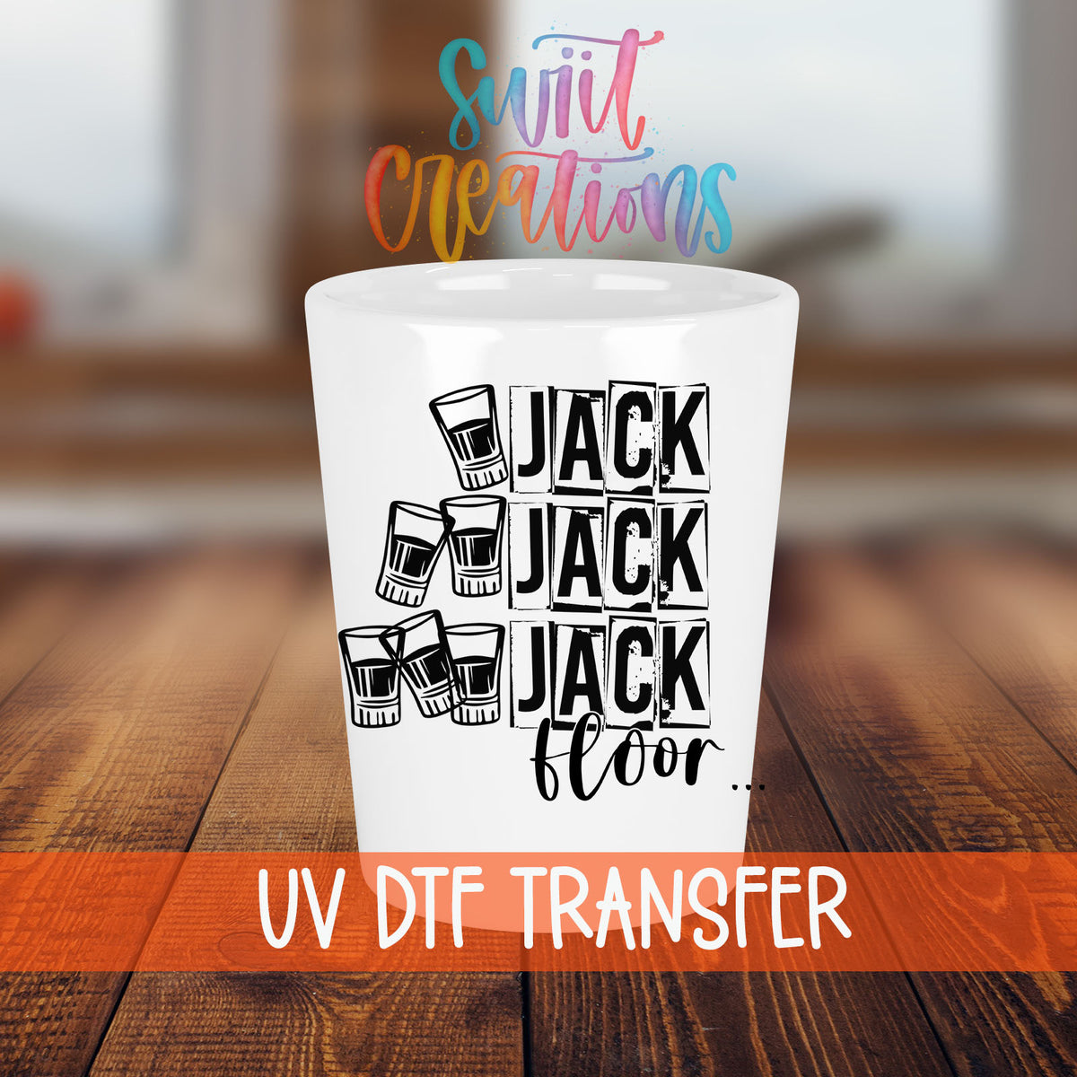 One Jack Two Jack Three Jack Floor shot glass transfer on a white shot glass on a wooden table