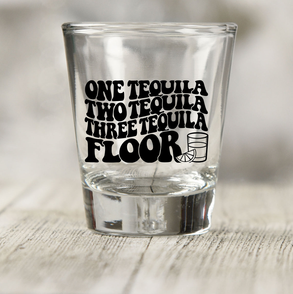 One Tequila Two Tequila shot glass UV DTF transfer with shot glass and lime slice outline on a clear shot glass