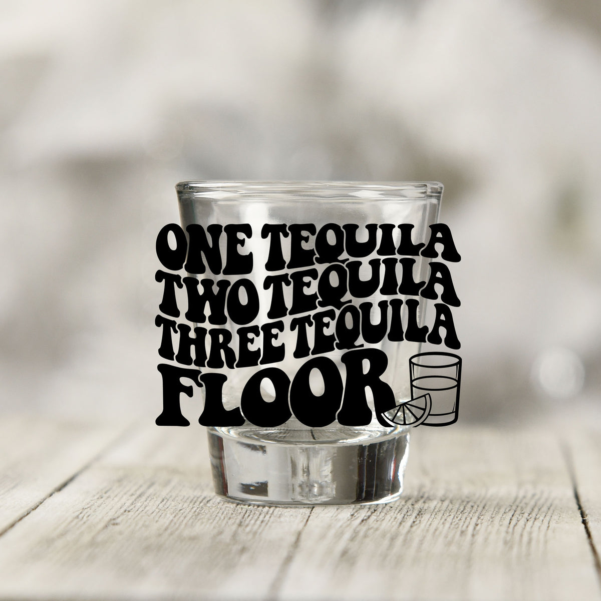 Close-up of the One Tequila Two Tequila UV DTF transfer on a clear shot glass