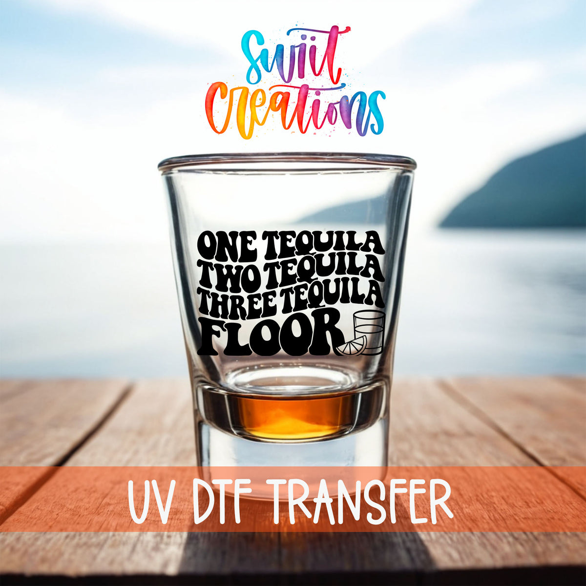 One Tequila Two Tequila shot glass UV DTF transfer on a filled shot glass on a dock by the water