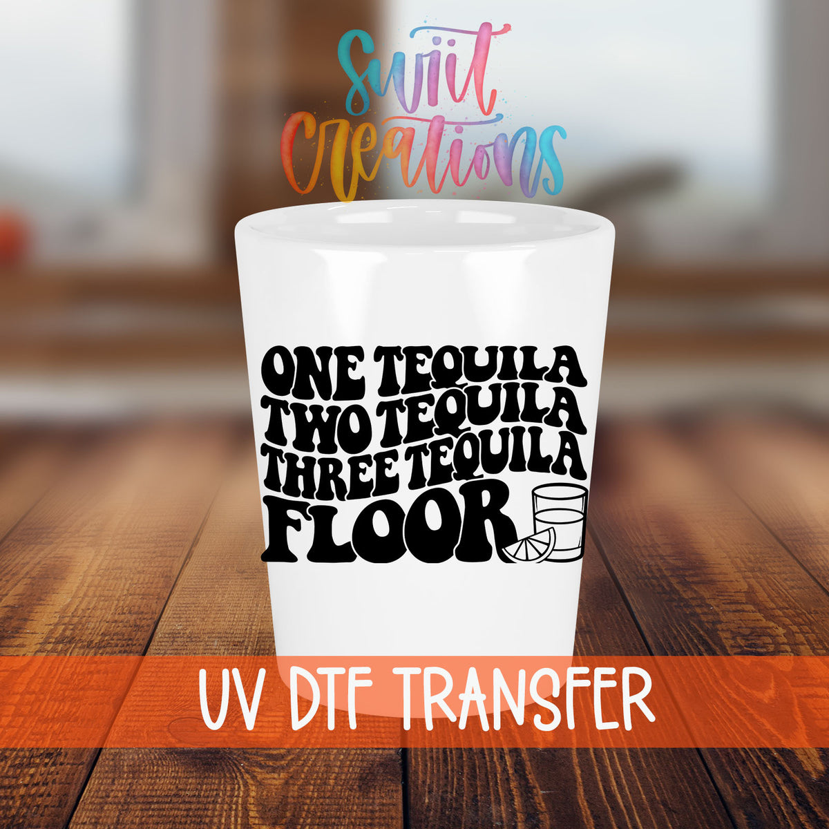 One Tequila Two Tequila shot glass transfer on a white shot glass on a wooden table