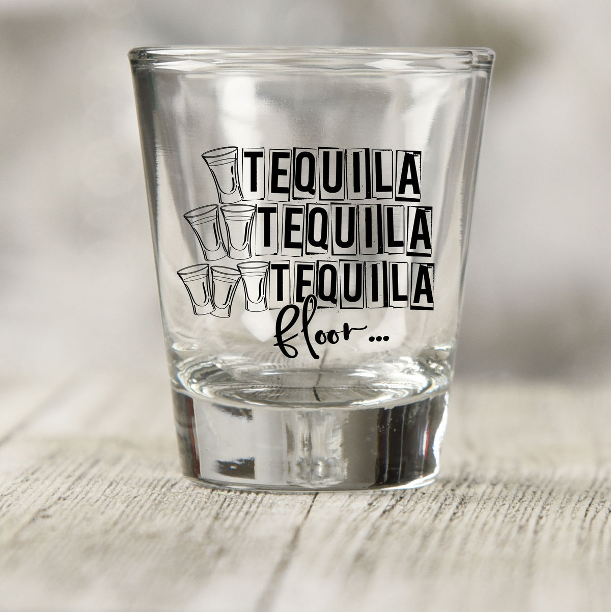 One Tequila Two Tequila Three Tequila Floor shot glass UV DTF transfer with outlined shot glass counting graphic on a clear shot glass