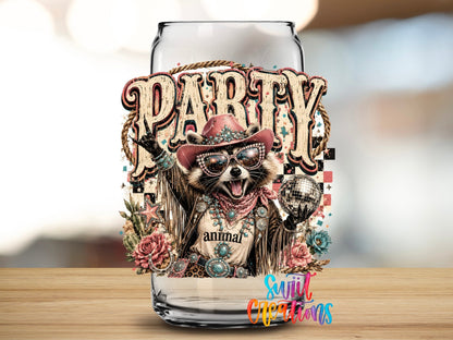 Party Animal Western Glam Raccoon UV DTF transfer applied to a clear glass can from Swiit Creations