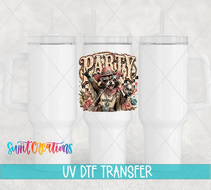 Party Animal Western Glam Raccoon UV DTF transfer applied to a white tumbler set from Swiit Creations