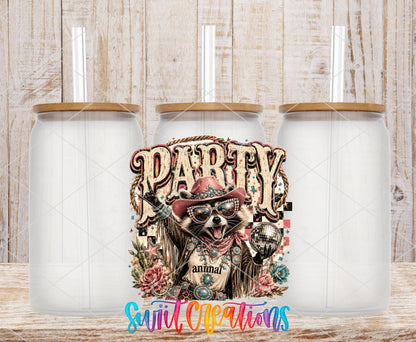 Party Animal Western Glam Raccoon UV DTF transfer applied to a clear glass can set from Swiit Creations
