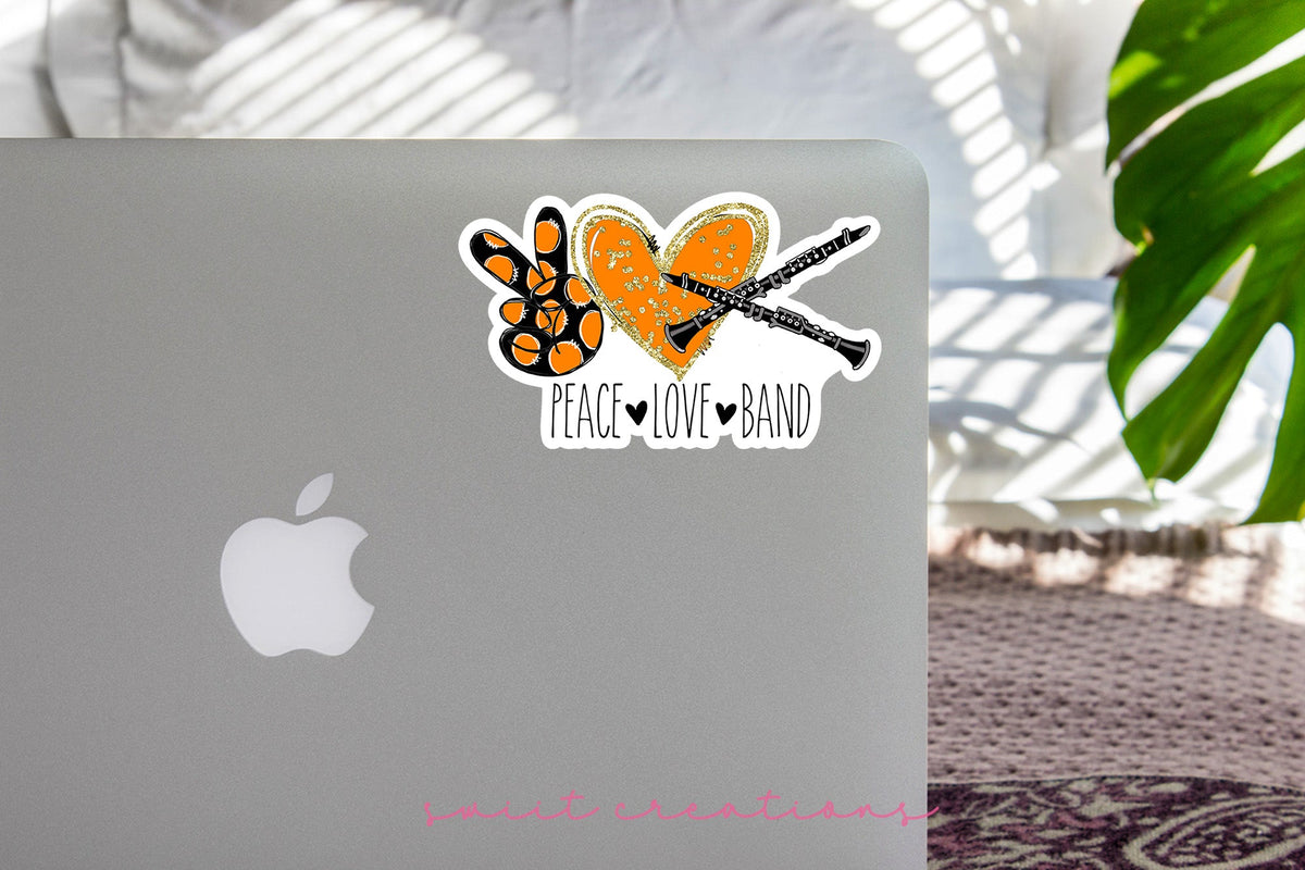 Peace Love Band Clarinet sticker on the lid of a silver laptop