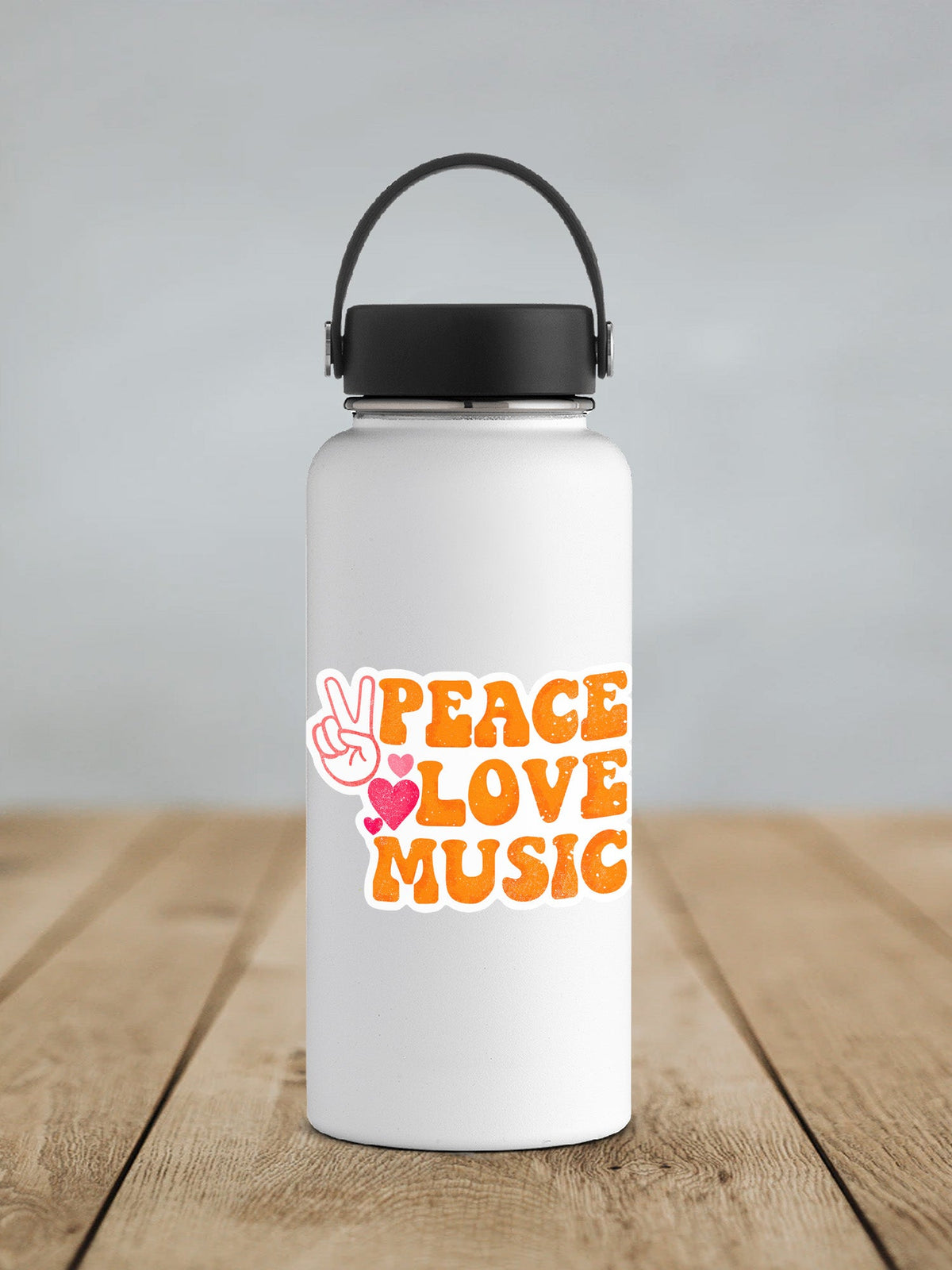 Peace Love Music sticker on a white insulated water bottle