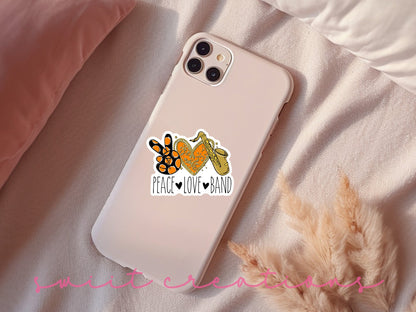 Peace Love Band Saxophone sticker on a pink phone case