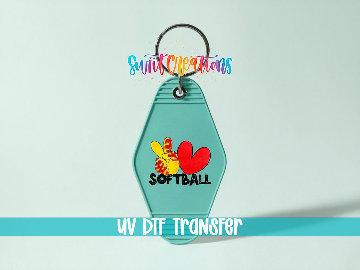Peace Love Softball UV DTF transfer on a teal motel keychain on a mint background