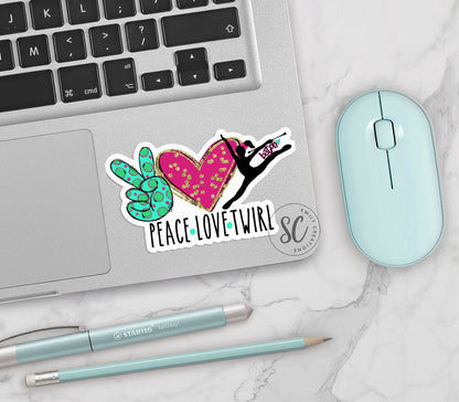 Peace Love Twirl vinyl sticker on a silver laptop next to a mint mouse and pens