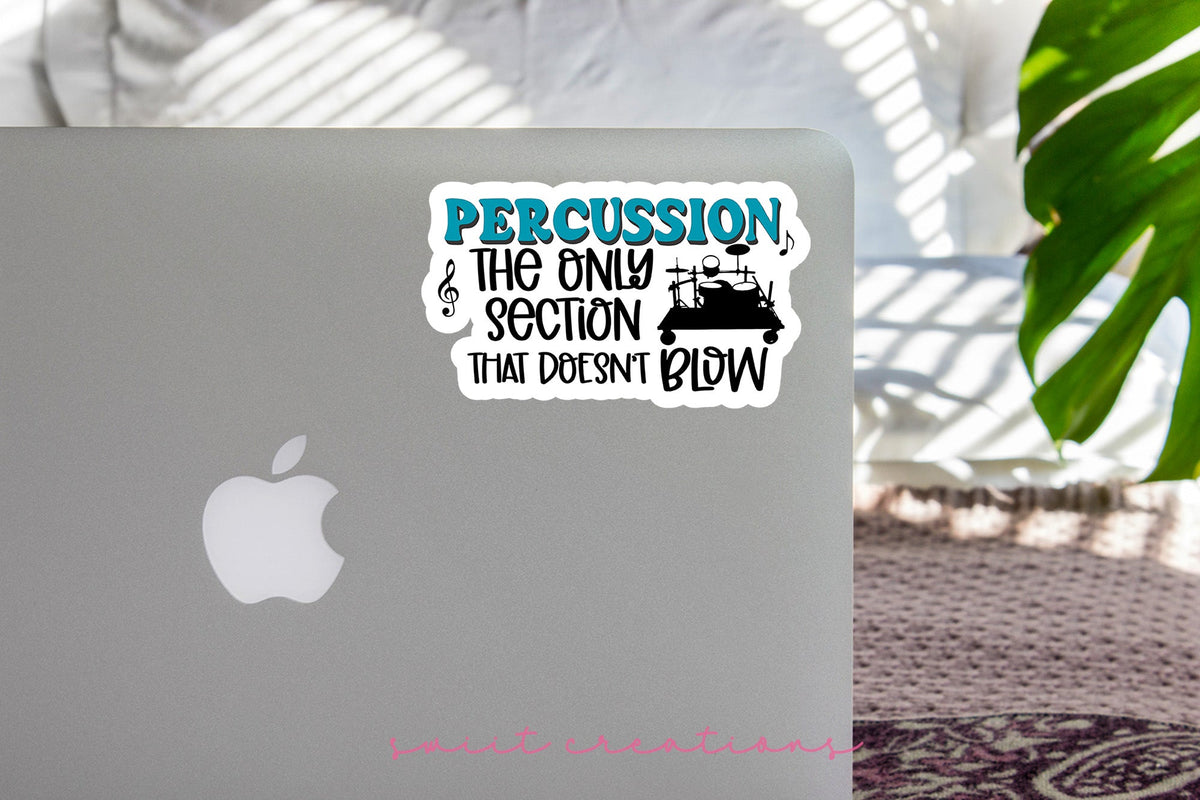 Percussion Doesn't Blow sticker on the lid of a silver laptop