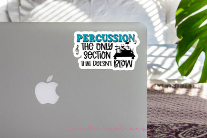 Percussion Doesn't Blow sticker on the lid of a silver laptop