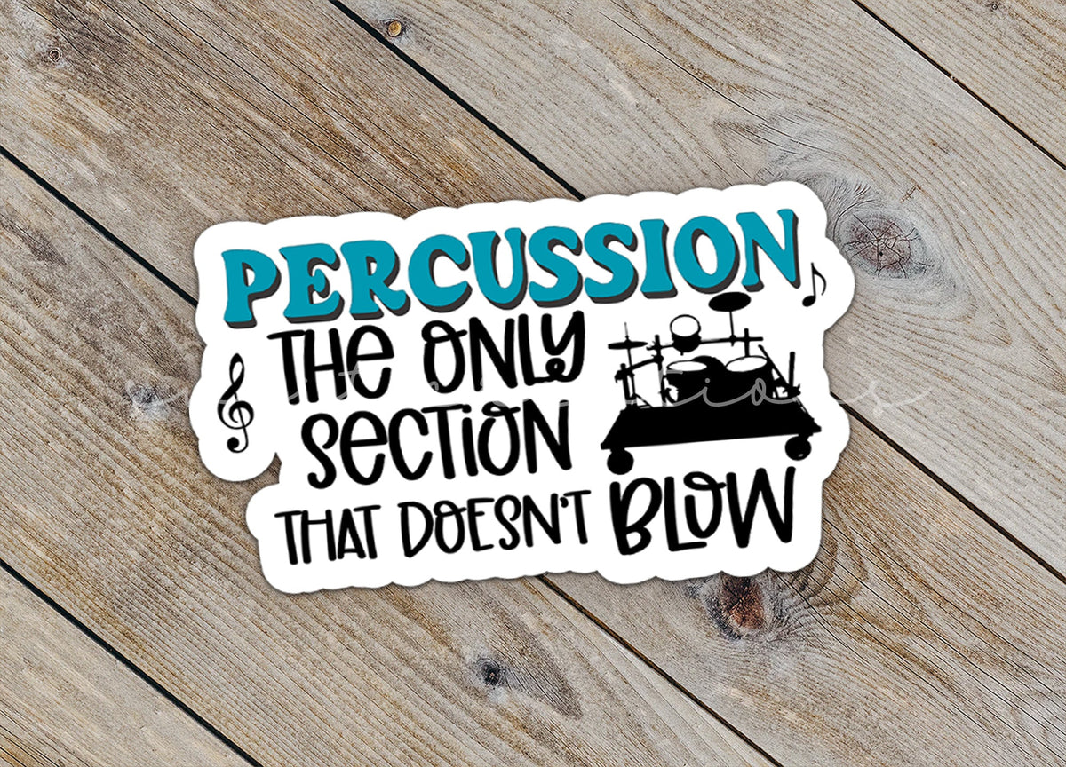 Close-up of the Percussion Doesn't Blow sticker on rustic wood