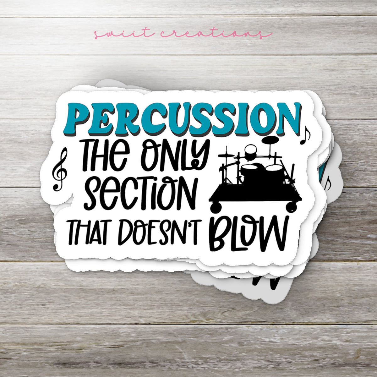 Stack of Percussion Doesn't Blow glossy stickers on a gray wood table
