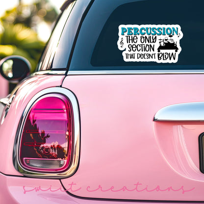 Percussion Doesn't Blow sticker on the back window of a pink car