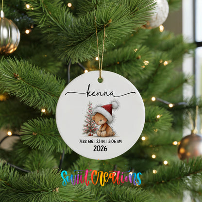Personalized Baby’s First Christmas Bunny Birth Stats ceramic ornament hanging on a lit green Christmas tree
