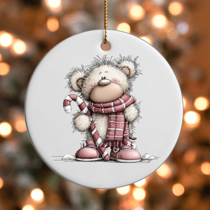 Pink Bear with Candy Cane ornament UV DTF transfer on a round white ornament with a bokeh light background