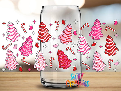 Close-up of the Pink Christmas Tree Cakes UV DTF full wrap on a clear glass can