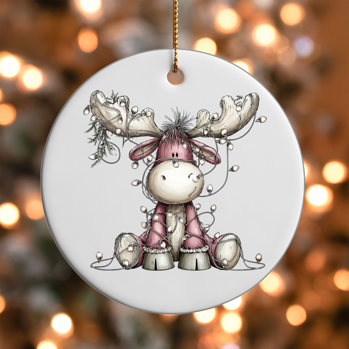 Pink Moose with Lights ornament UV DTF transfer on a round white ornament with a bokeh light background
