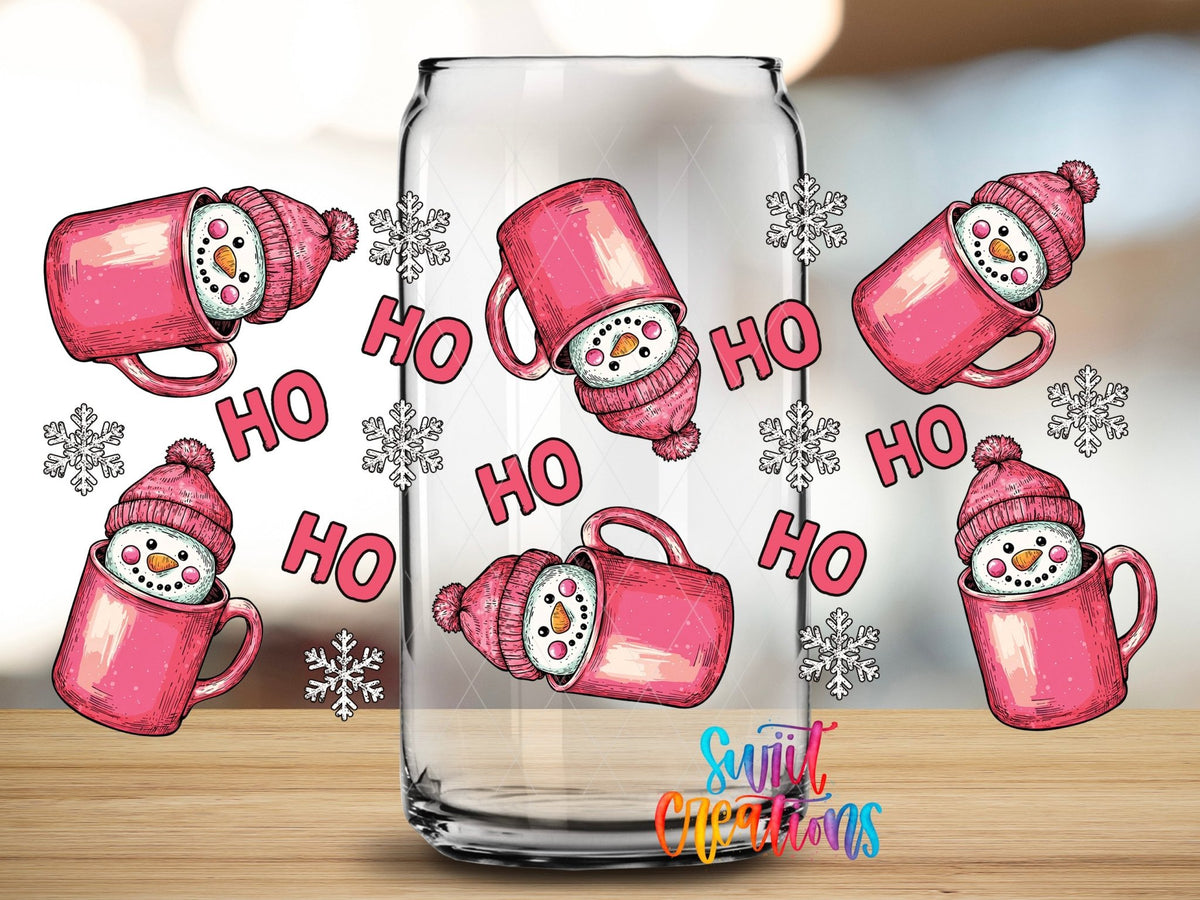 Close-up of the Ho Ho Pink Snowman Mugs UV DTF wrap on a clear glass can
