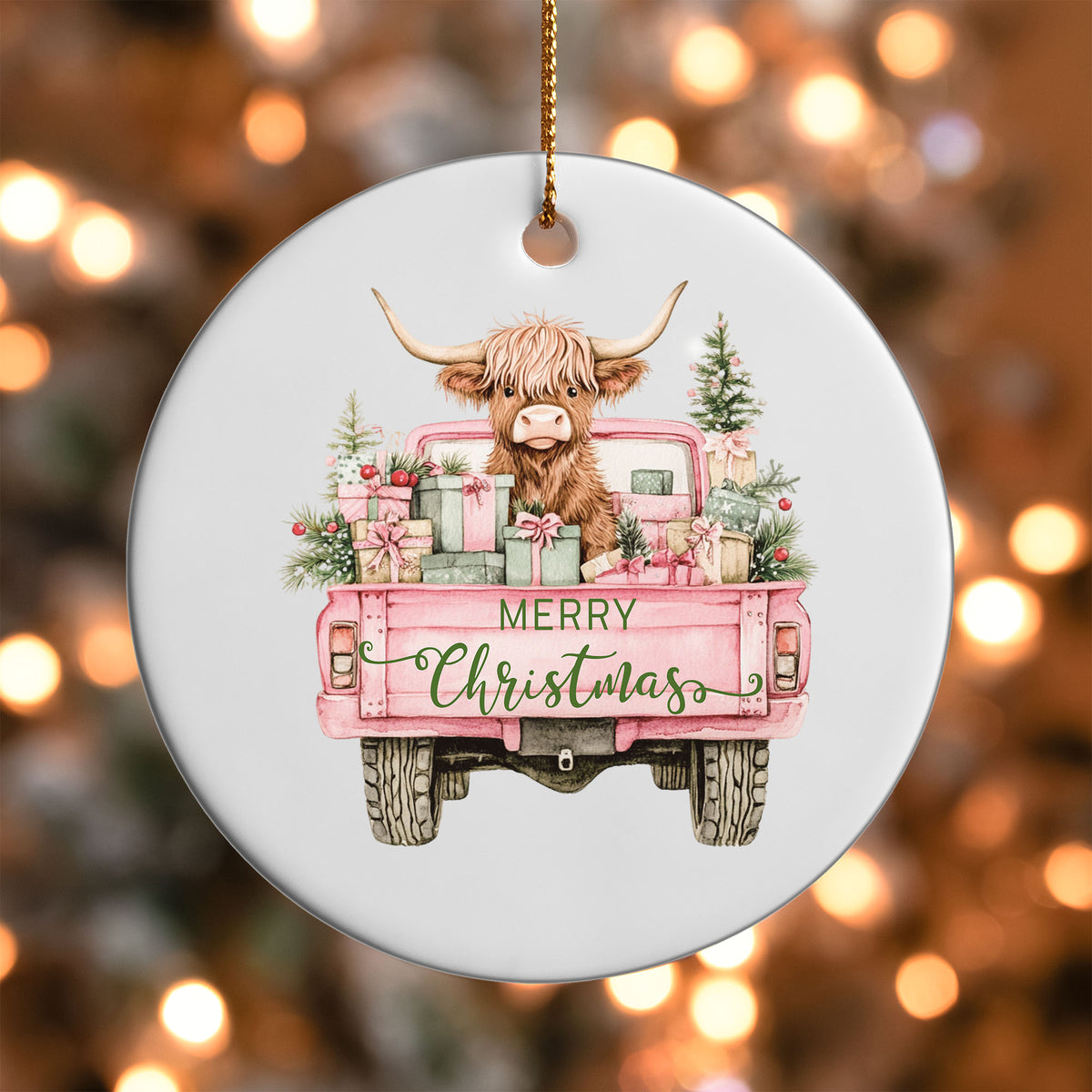 Pink Truck Highland Cow ornament UV DTF transfer on a round white ornament with a bokeh light background