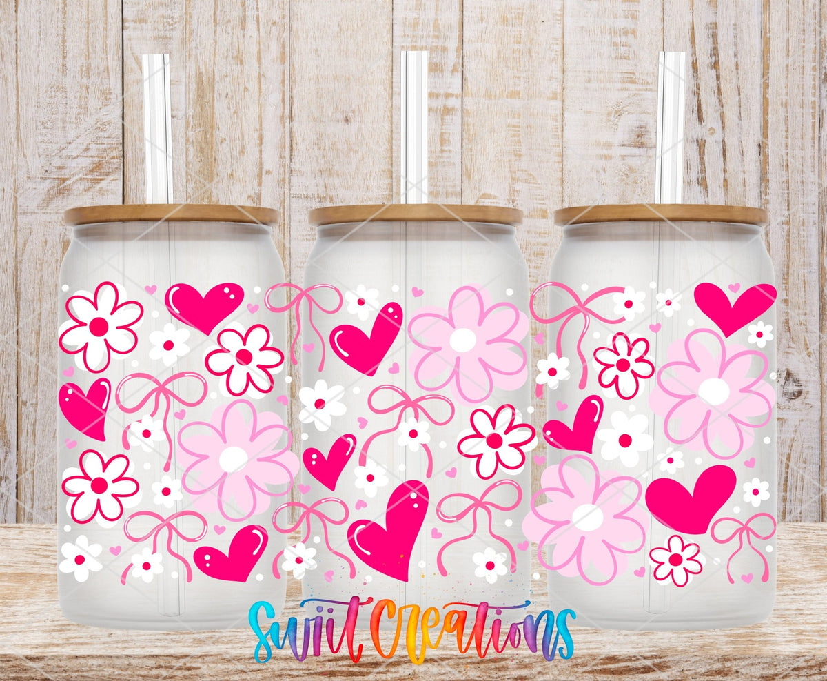 Pink Valentine Floral Hearts and Bows UV DTF full wrap on three clear glass cans with bamboo lids