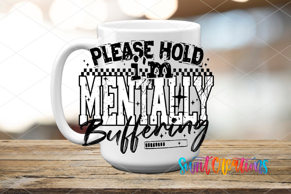 Please Hold I’m Mentally Buffering UV DTF transfer displayed on a white ceramic mug from Swiit Creations