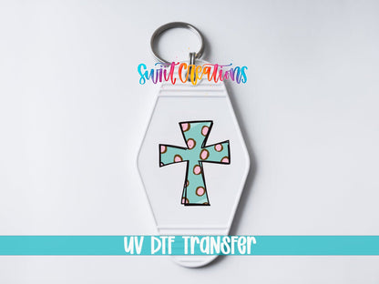 Polka Dot Cross UV DTF transfer on a white motel keychain on a white background