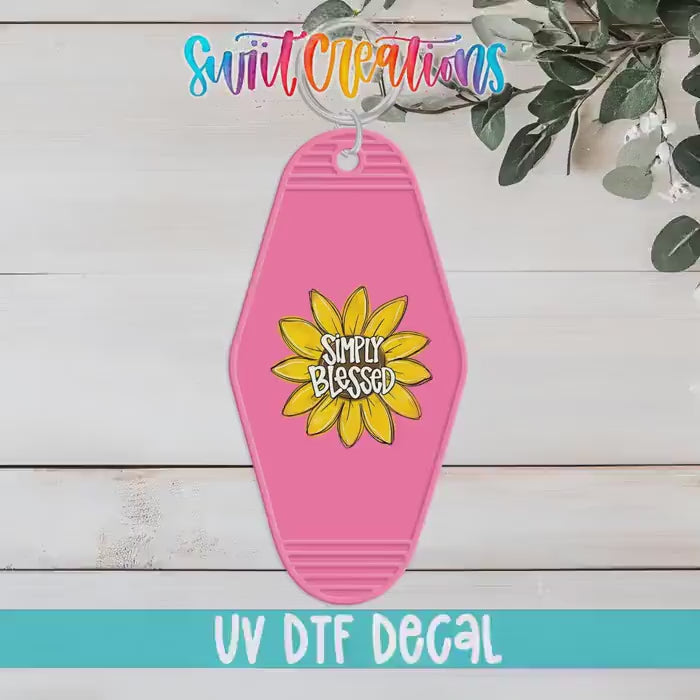 Video of the Simply Blessed motel keychain UV DTF transfer