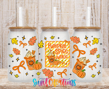 Pumpkin Spice Junkie UV DTF wrap on three clear glass cans with bamboo lids