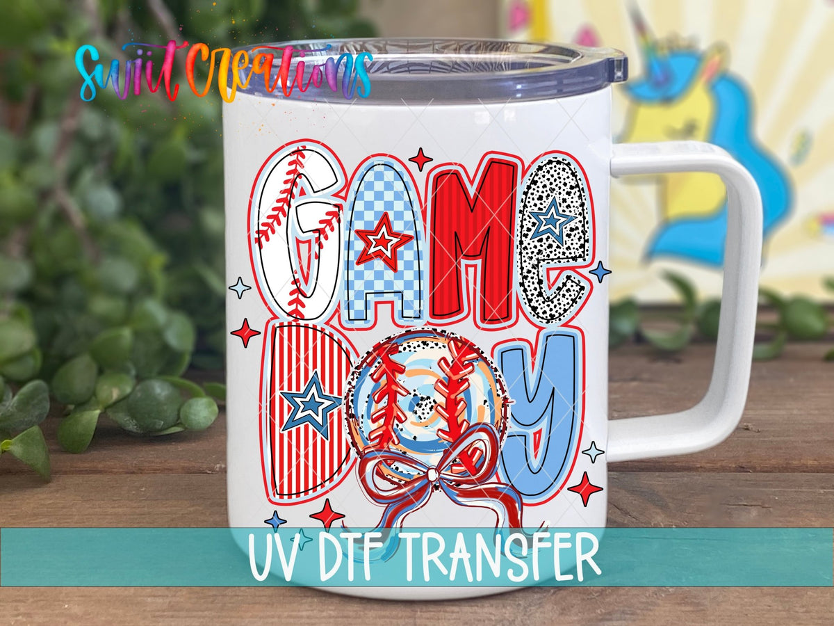 Game Day red, white, and blue baseball UV DTF transfer on a white stainless steel mug with a lid