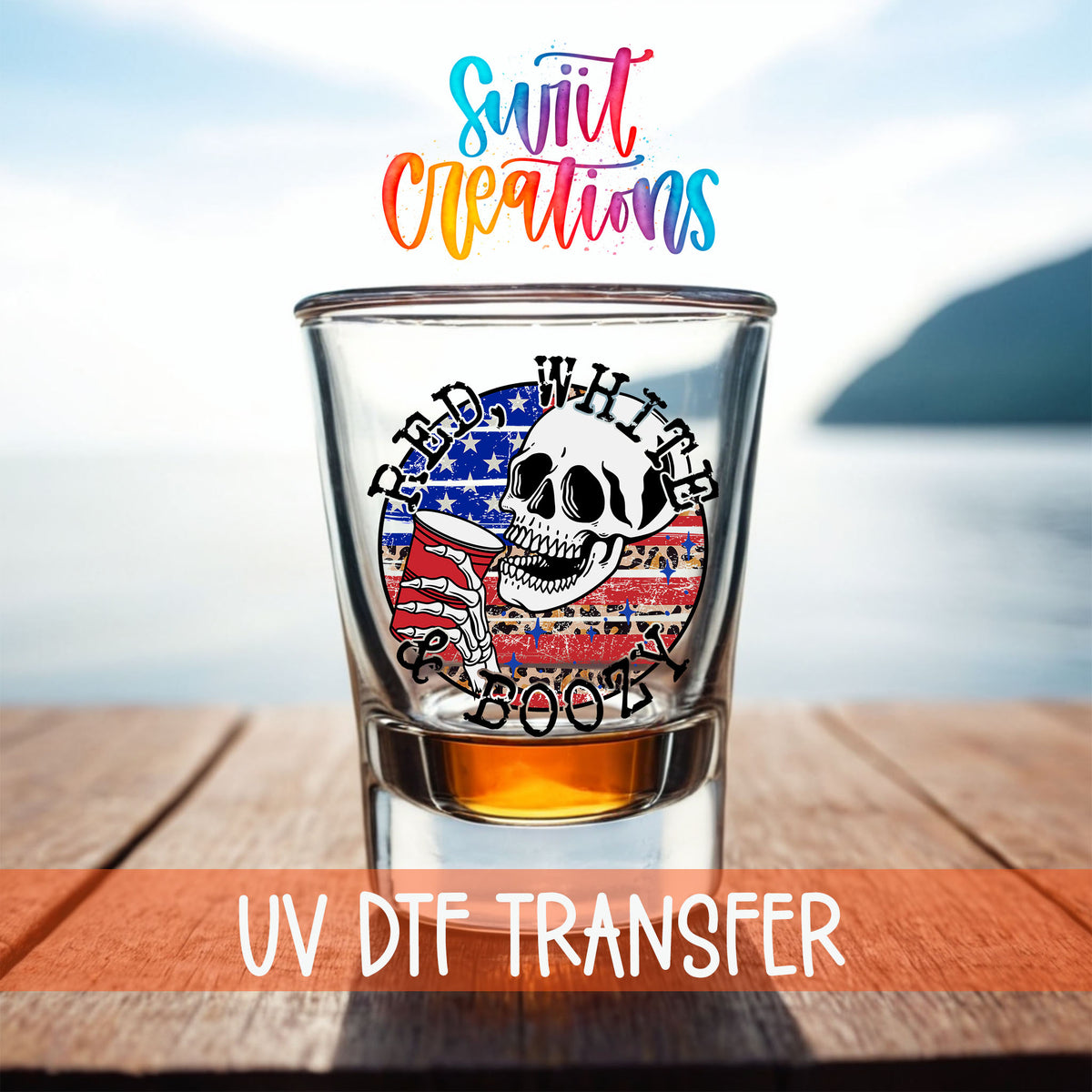 Red White and Boozy shot glass UV DTF transfer on a filled shot glass on a dock by the water