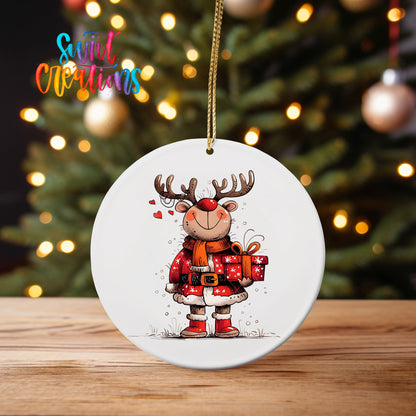 Reindeer in Red Plaid ornament UV DTF transfer on an ornament on a wooden table with tree lights behind it