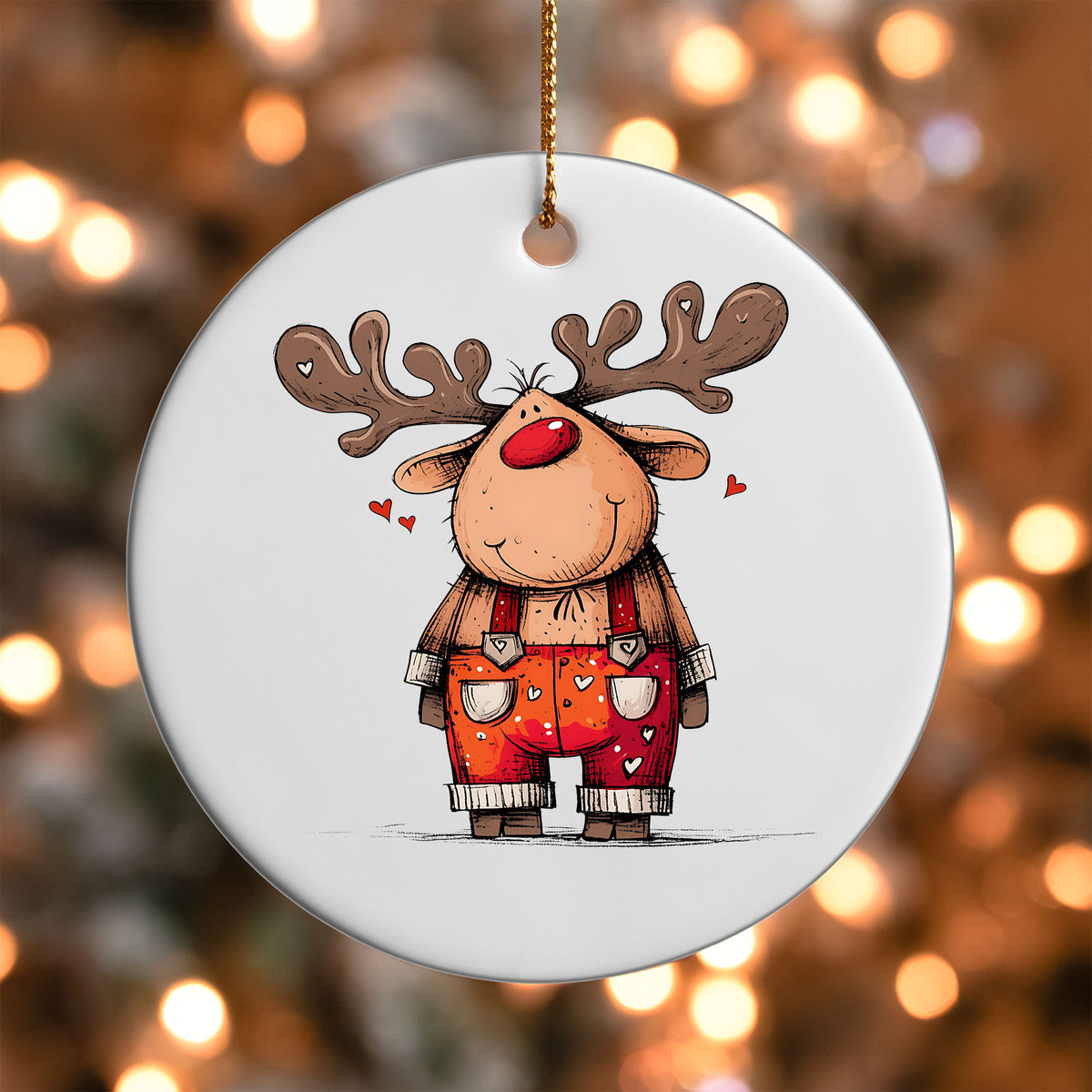 Reindeer in Red Overalls ornament UV DTF transfer on a round white ornament with a bokeh light background