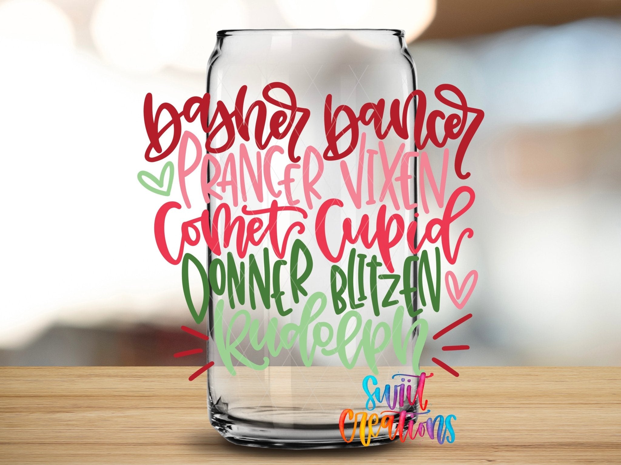 Swiit Creations Reindeer Names Christmas colorful holiday word art UV DTF transfer shown on a clear glass can
