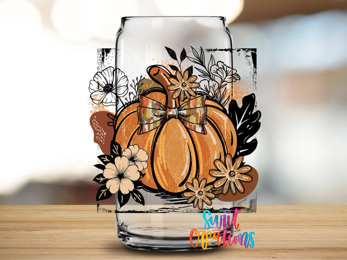 Close-up of the Retro Boho Pumpkin UV DTF transfer on a clear glass can